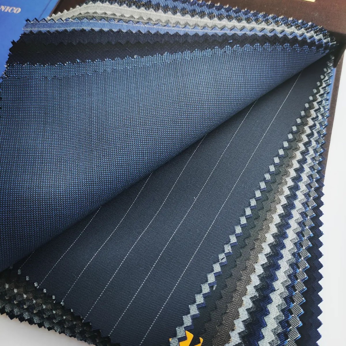 Close-up of bespoke suit fabric swatches